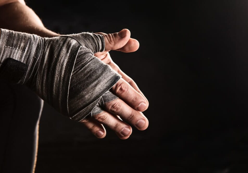 close-up-hand-muscular-man-with-bandage